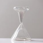 Sand timer for measuring time intervals, ideal for science experiments and educational activities.
