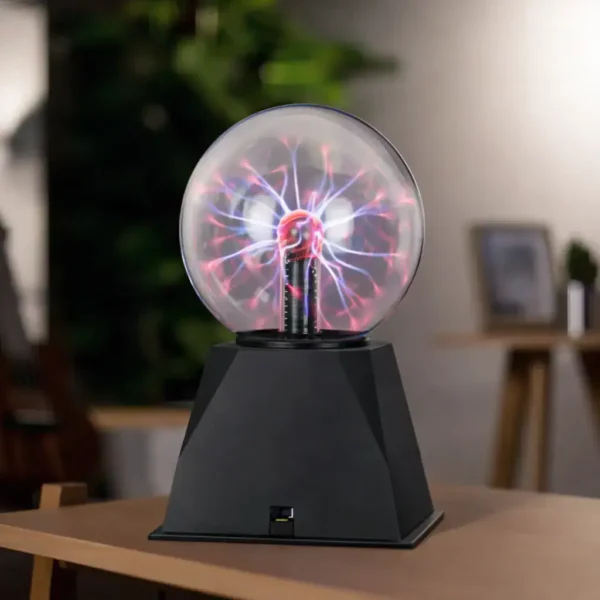 Tesla coil plasma ball displaying colorful electrical discharges inside a glass sphere on a black base, perfect for science education and decor.