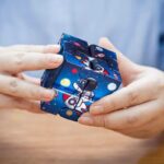 Colorful space-themed puzzle cube featuring astronauts, planets, and rockets, perfect for educational play and STEM learning.