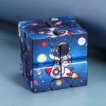 Rocket astronaut puzzle cube with space-themed design for kids and adults.