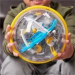 Colorful marble run toy with various tracks and components inside a transparent ball.