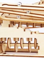 Wooden marble run with metal balls and gears, educational science toy for kids and STEM learning.