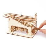Wooden marble run with multiple tracks and metal balls for hands-on learning and entertainment.