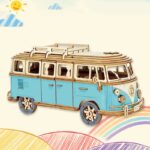 Wooden camper van toy with detailed design and vibrant blue accents.