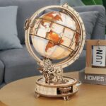 An intricate wooden mechanical globe puzzle featuring a rotating Earth with detailed continents and latitude/longitude lines, perfect for educational decor and science enthusiasts.