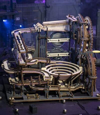 A detailed wooden mechanical clockwork model showcasing gears, levers, and intricate moving parts, perfect for science enthusiasts and educational purposes.