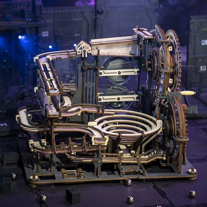 A detailed wooden mechanical clockwork model showcasing gears, levers, and intricate moving parts, perfect for science enthusiasts and educational purposes.
