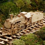 Detailed wooden train model on miniature railway track, perfect for educational play and decorative display, showcasing craftsmanship and intricate design.