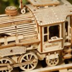 Wooden train model with detailed craftsmanship, perfect for children’s educational play and decor. Made from natural wood, it promotes creativity and fine motor skills.