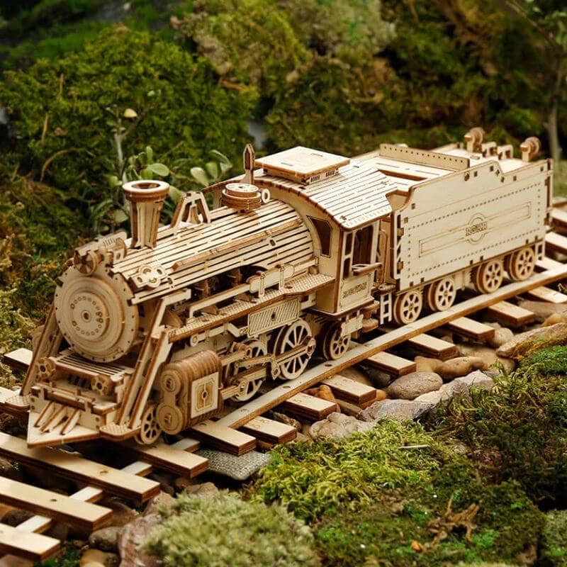 Detailed wooden train model on miniature railway track, perfect for educational play and decorative display, showcasing craftsmanship and intricate design.
