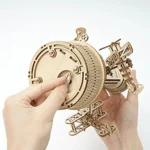 Detailed wooden spacecraft model with rotating parts and intricate design, perfect for science enthusiasts and educational purposes.
