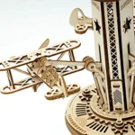Detailed wooden airplane with intricate cutouts and a mechanical clock tower structure, perfect for science-themed decor and educational toy displays.