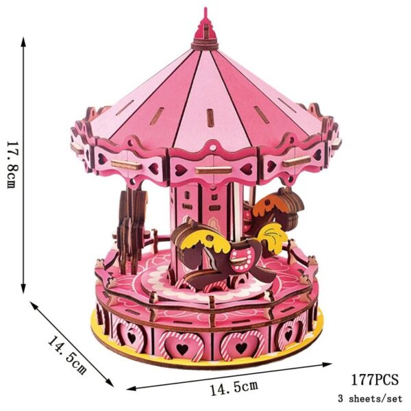 Colorful pink carousel music box with detailed horses and decorative elements, perfect for children's playrooms and educational decor.