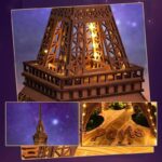 Detailed wooden Eiffel Tower lamp with warm lighting, perfect for decor or educational purposes.