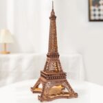 Detailed wooden puzzle model of the Eiffel Tower, perfect for educational and decorative purposes, showcasing intricate craftsmanship and design.