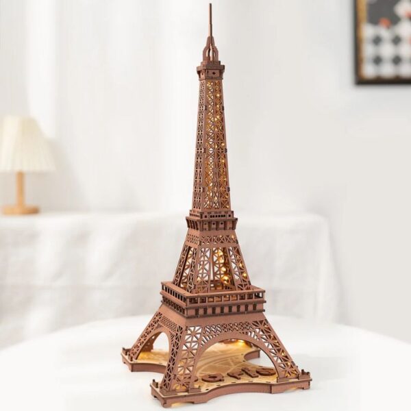 Detailed wooden puzzle model of the Eiffel Tower, perfect for educational and decorative purposes, showcasing intricate craftsmanship and design.
