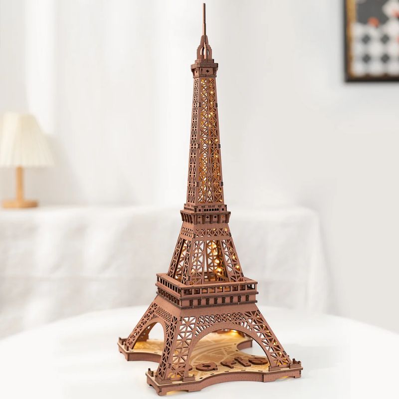 Detailed wooden puzzle model of the Eiffel Tower, perfect for educational and decorative purposes, showcasing intricate craftsmanship and design.