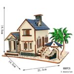 Detailed miniature house with outdoor furniture and palm trees.