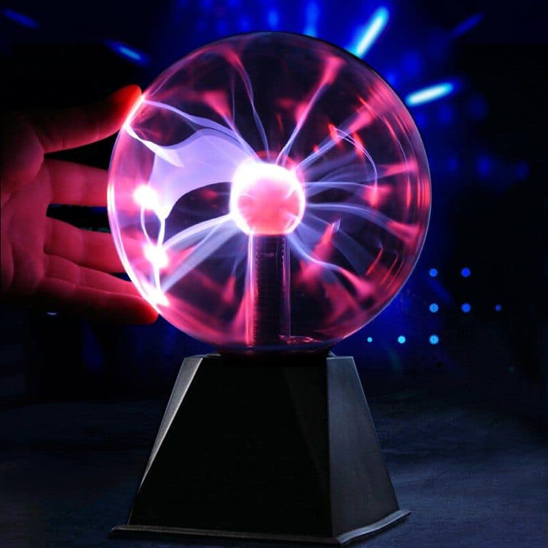 Plasma globe displaying colorful electric discharges inside a glass sphere, used for educational demonstrations and science decor.