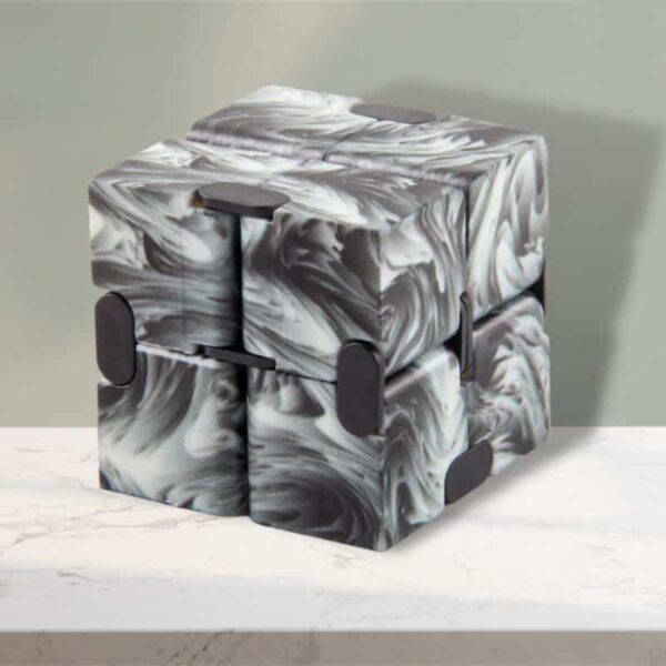 Innovative marble-like puzzle cube with black accents, perfect for science-themed decor and educational activities.