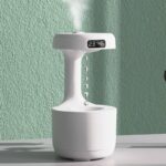 Innovative digital alarm clock with a built-in water fountain, displaying the time 23:48, perfect for tech enthusiasts and modern decor.
