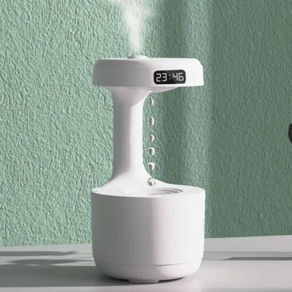 Innovative digital alarm clock with a built-in water fountain, displaying the time 23:48, perfect for tech enthusiasts and modern decor.