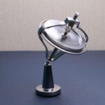 A magnetic levitating spinner demonstrating magnetic repulsion and levitation technology, perfect for educational science demonstrations and science decor.
