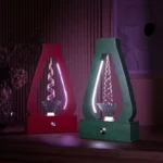 Two colorful magnetic spiral light displays, one red and one green, showcasing dynamic swirling patterns inside transparent bases, perfect for science decor and educational demonstrations.