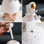 Moon lamp with a textured surface resembling the moon, mounted on a simple wooden stand for decorative display.