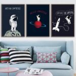 Set of three space-themed wall art prints featuring astronauts and planets, perfect for a science-inspired room decor.