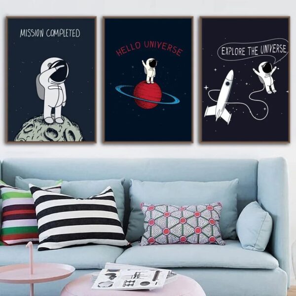 Set of three space-themed wall art prints featuring astronauts and planets, perfect for a science-inspired room decor.