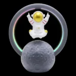LED astronaut figure floating above a textured moon model with a colorful illuminated ring background.