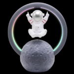 Cute astronaut figure floating above a detailed moon model, surrounded by a colorful neon ring, set against a black background. Perfect for science decor and educational displays.