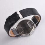 Classic wristwatch with black leather strap and silver metal case, minimalist design, suitable for casual and formal wear.