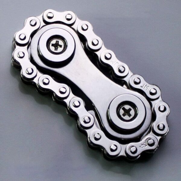 Close-up of a metallic bike chain link with detailed sprockets, showcasing mechanical precision and engineering design.