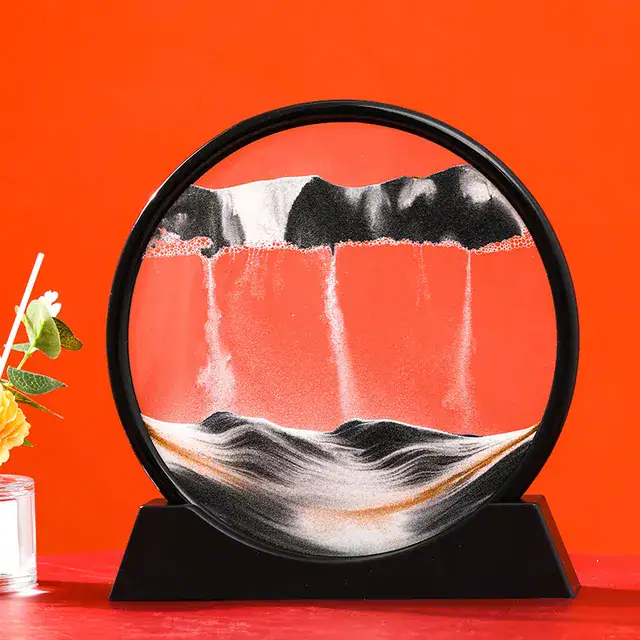 Unique liquid motion display with flowing white liquid and black accents in a glass sphere.