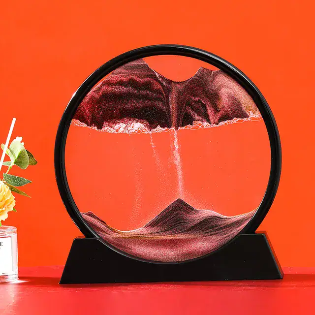 A mesmerizing magnetic water fountain with colorful mineral particles flowing in a circular glass frame, creating a captivating visual effect.