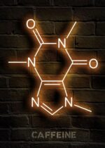 Neon sign of a caffeine molecule illuminated on a brick wall, showcasing the chemical structure with glowing lines and labels. Perfect for science decor and educational displays.
