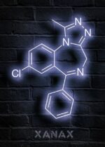 Neon sign displaying the molecular structure of Xanax, with glowing white lines and letters on a dark brick wall background.