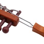 Hand-crank wooden and metal science toy with gears and levers for educational play.