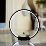 Modern magnetic levitation globe lamp with LED lighting, floating in mid-air above a sleek base, creating a futuristic and stylish decor piece.