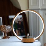 LED mirror with wooden frame and touch sensor, ideal for modern home decor and personal grooming. Features adjustable lighting and sleek design for a stylish, functional addition to any room.