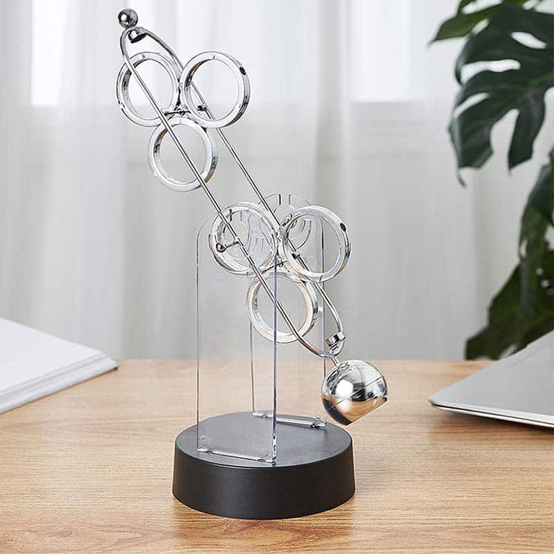 Educational magnetic science toy with metal rings and ball, demonstrating magnetic forces and physics principles.