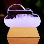 A cloud-shaped science decor lamp with a wooden base, featuring a glowing, illuminated cloud design perfect for educational spaces or as a unique night light.