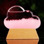 Educational cloud science kit with pink liquid and transparent dome for experiments.