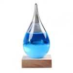 Dropper with Blue Liquid in a Glass Flask on Wooden Base.