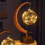 Decorative moon-shaped lamp with warm fairy lights, perfect for science-themed decor and educational spaces.