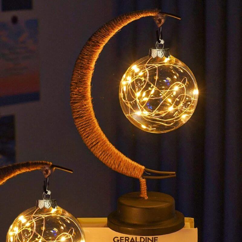 Magnetic Moon Lamp with Fairy Lights Decorative moon-shaped lamp with warm fairy lights, perfect for science-themed decor and educational spaces.