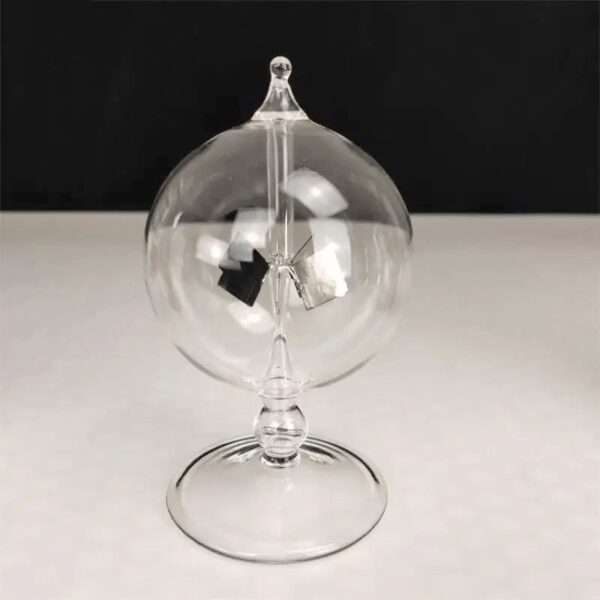 Elegant glass globe with internal metallic components for science experiments and decor.