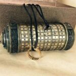 Vintage cipher wheel with rotating rings and rings for decoding messages, ideal for educational puzzles and science gadgets.